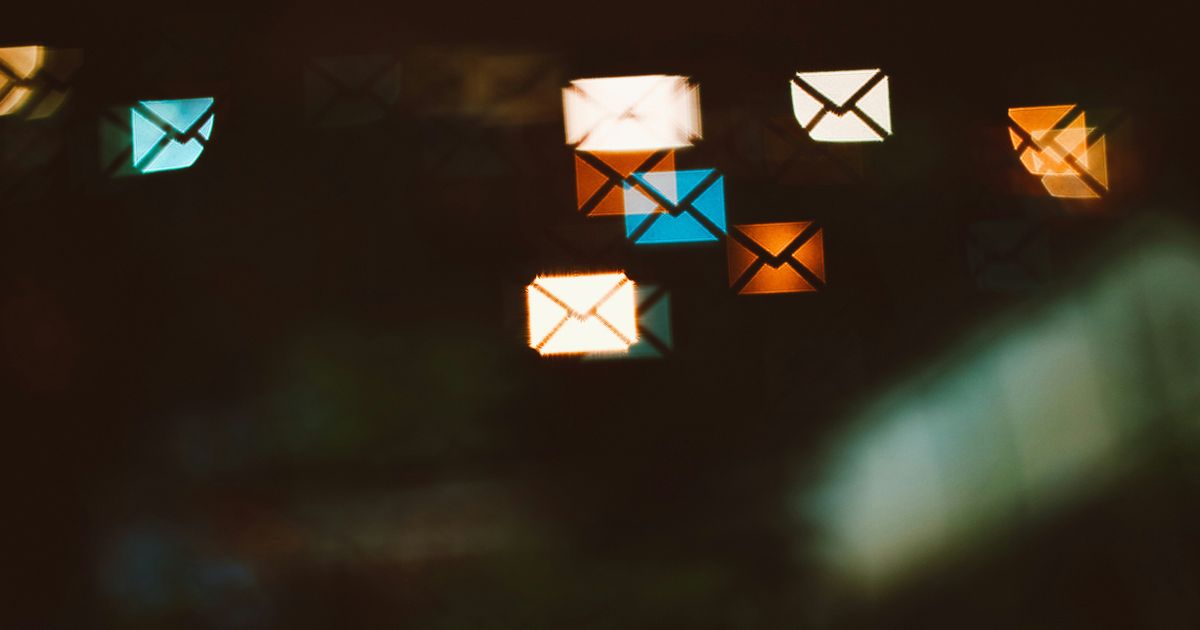 Illustration of email marketing services: envelope icons and campaign planning notes on a whiteboard